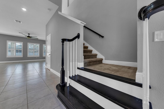 staircase featuring ceiling fan, tile patterned flooring, visible vents, and baseboards