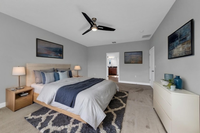 bedroom featuring light carpet, baseboards, and visible vents