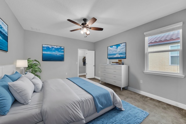 bedroom with a ceiling fan, carpet, visible vents, and baseboards