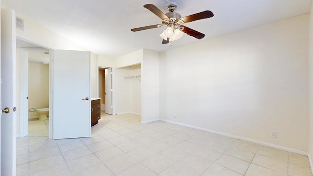 unfurnished bedroom featuring ceiling fan, visible vents, baseboards, and a closet