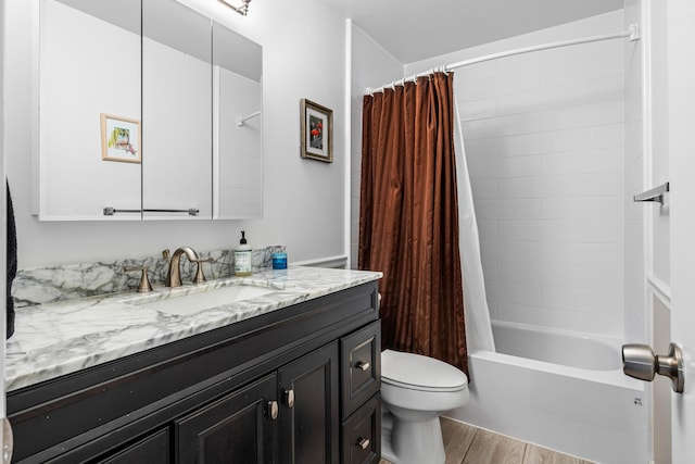 bathroom with shower / bath combo with shower curtain, vanity, toilet, and wood finished floors