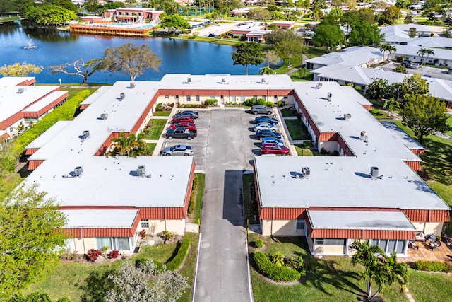 drone / aerial view with a residential view and a water view