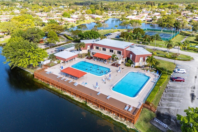 birds eye view of property with a water view