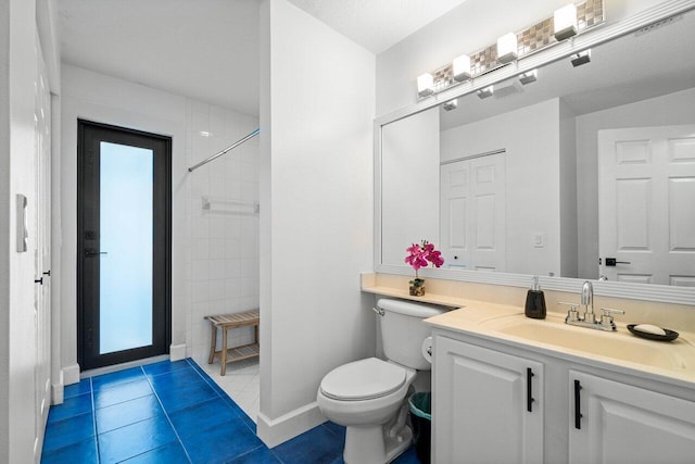 full bathroom with toilet, vanity, baseboards, a shower, and tile patterned floors