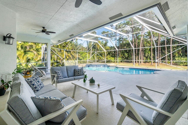 pool featuring a ceiling fan, a lanai, a patio area, and an outdoor living space