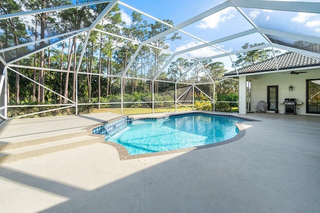 outdoor pool featuring grilling area, a patio area, a lanai, and a ceiling fan