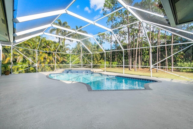 pool featuring a lanai and a patio area