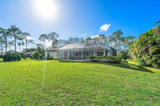 view of yard featuring a lanai