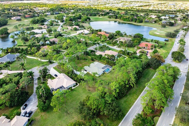 drone / aerial view featuring a water view and a residential view