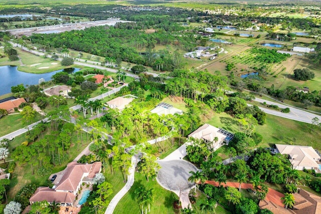 birds eye view of property featuring a water view and a residential view