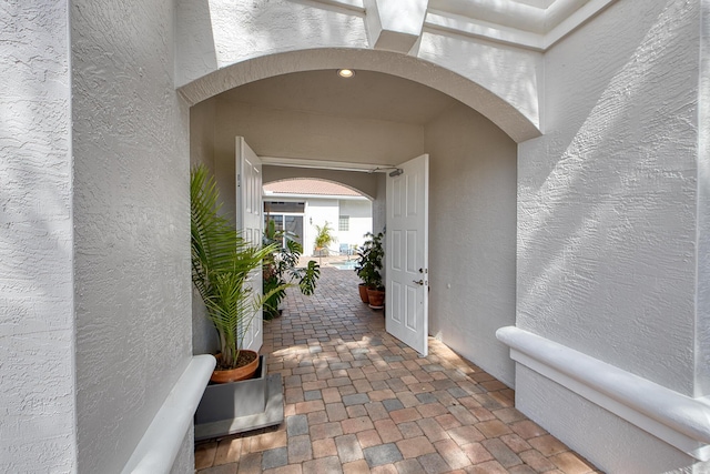 property entrance with stucco siding