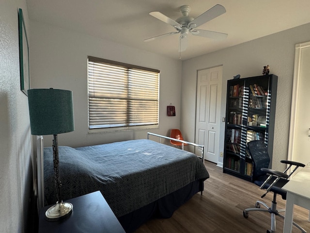 bedroom with ceiling fan and wood finished floors