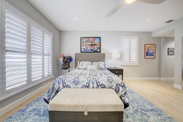 bedroom featuring recessed lighting, a ceiling fan, visible vents, baseboards, and light wood finished floors