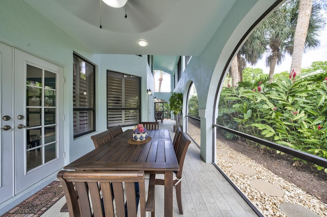 sunroom with a ceiling fan