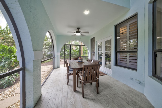 view of patio / terrace featuring ceiling fan, french doors, and outdoor dining space