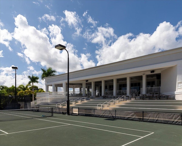 view of sport court featuring fence