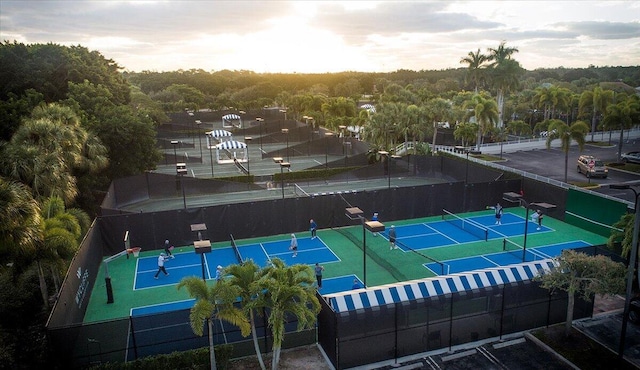 view of tennis court with fence