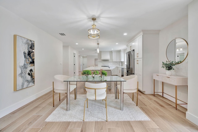 dining space featuring light wood-type flooring, visible vents, baseboards, and recessed lighting