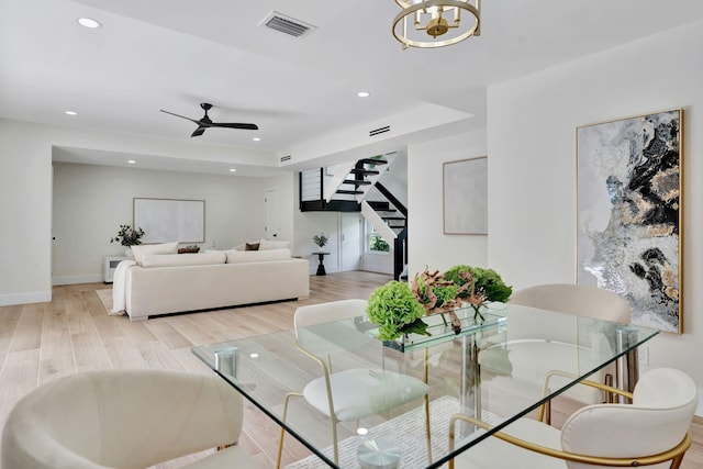 dining area with recessed lighting, visible vents, light wood-style flooring, baseboards, and stairs