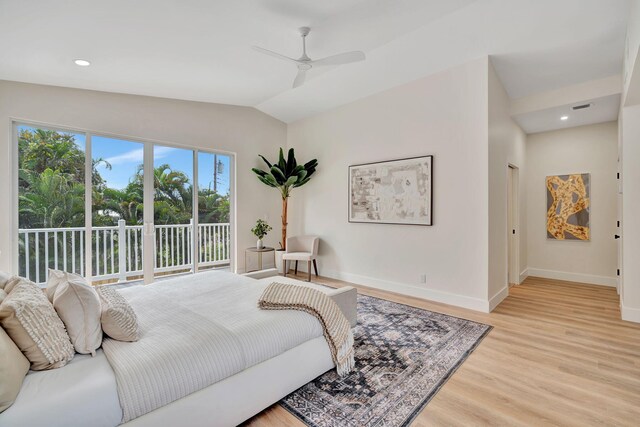 bedroom with lofted ceiling, wood finished floors, a ceiling fan, baseboards, and access to outside