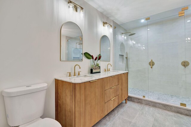 full bathroom with double vanity, a stall shower, a soaking tub, and a sink