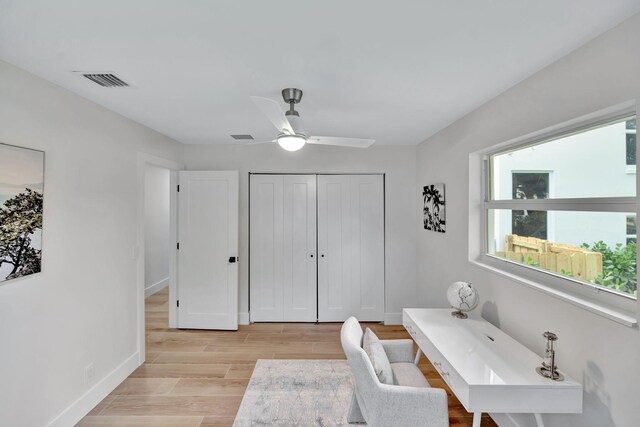 office area featuring a wealth of natural light, visible vents, and light wood-style flooring