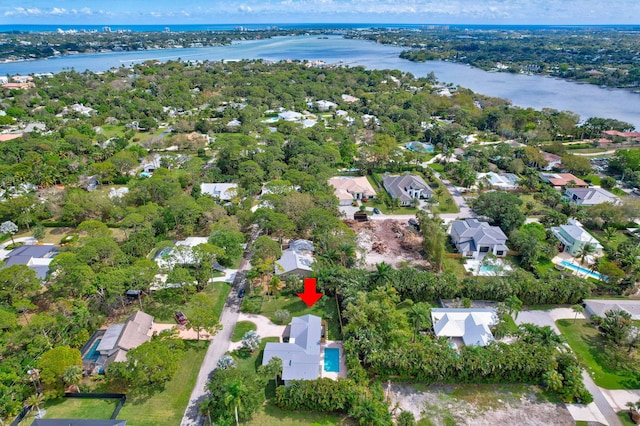 birds eye view of property featuring a water view and a residential view