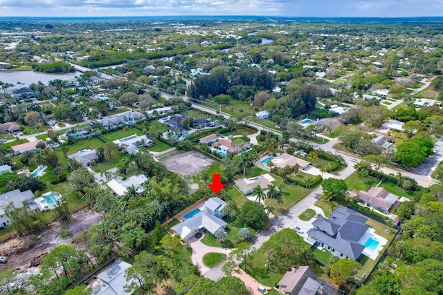 bird's eye view featuring a water view and a residential view