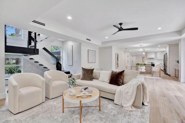 kitchen featuring a center island, pendant lighting, appliances with stainless steel finishes, white cabinetry, and extractor fan