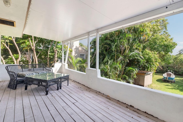 wooden terrace featuring outdoor dining area