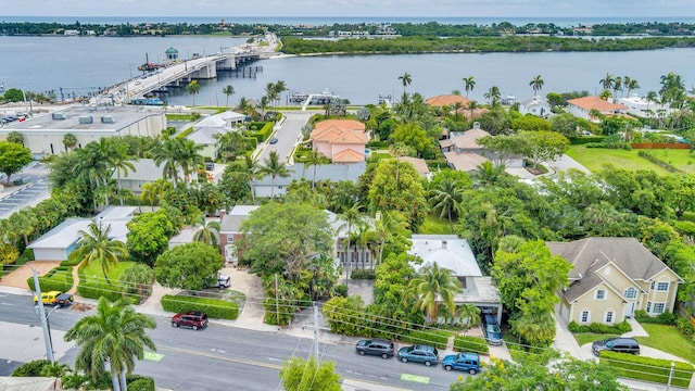 drone / aerial view featuring a water view and a residential view