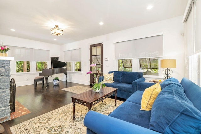 living area with a wealth of natural light, wood finished floors, and recessed lighting