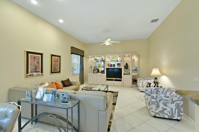 living room with a ceiling fan, recessed lighting, visible vents, and light tile patterned floors