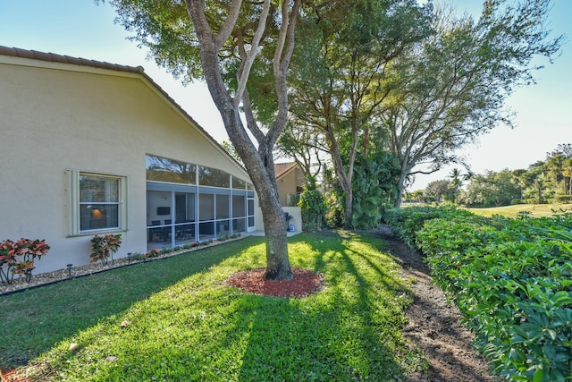 view of yard featuring a sunroom