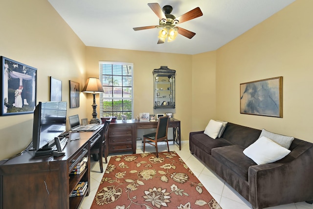 home office with ceiling fan, baseboards, and light tile patterned flooring