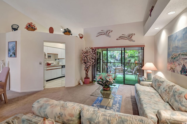 living room featuring light carpet, lofted ceiling, baseboards, and recessed lighting