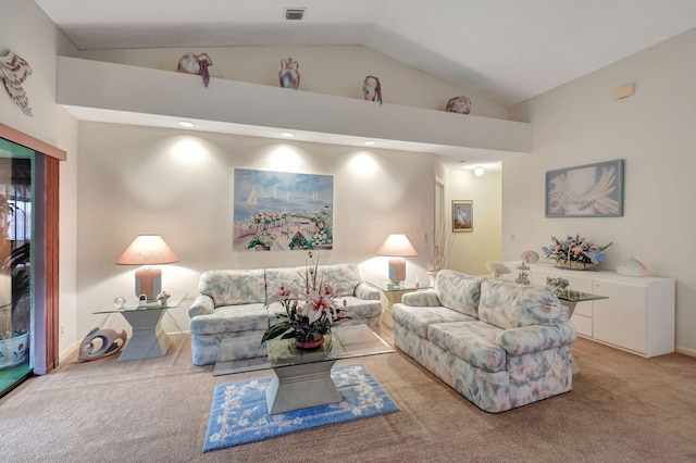 living area featuring high vaulted ceiling, light carpet, visible vents, and baseboards