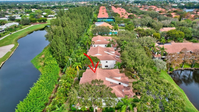 bird's eye view featuring a water view and a residential view