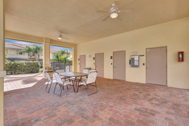 view of patio / terrace with outdoor dining space, ceiling fan, and fence