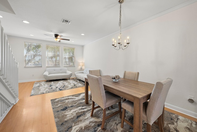 dining space featuring recessed lighting, visible vents, light wood-style floors, ornamental molding, and baseboards