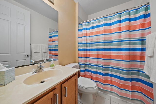 full bathroom with curtained shower, vanity, toilet, and tile patterned floors