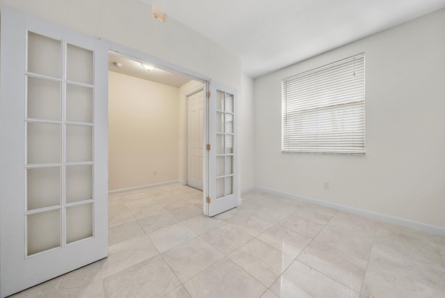 empty room featuring baseboards