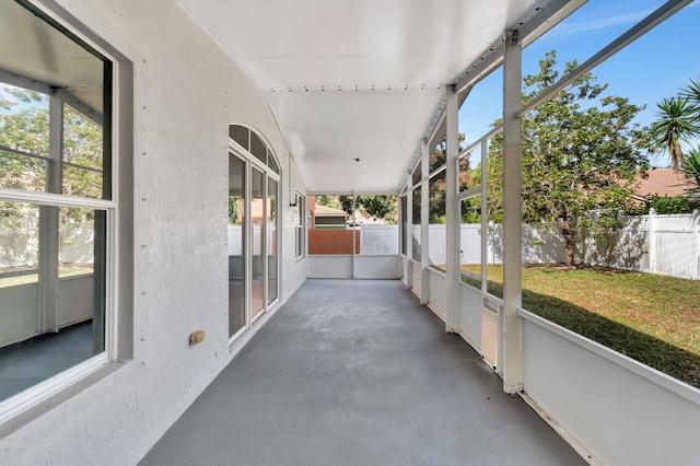 unfurnished sunroom featuring a healthy amount of sunlight