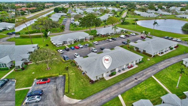 aerial view featuring a residential view and a water view