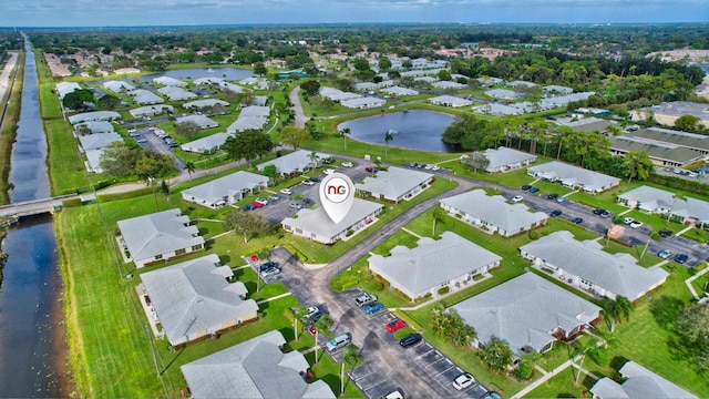 aerial view featuring a water view and a residential view