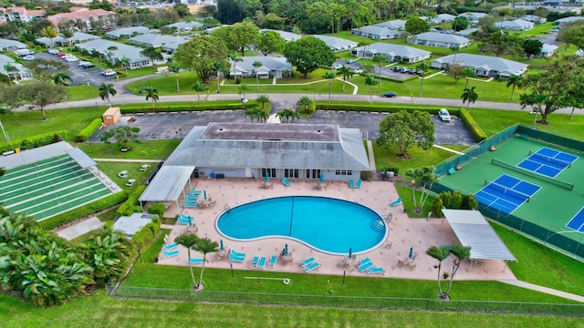 pool featuring a residential view and a patio