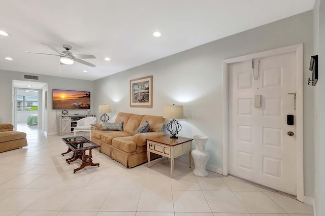 living area featuring light tile patterned floors, baseboards, visible vents, a ceiling fan, and recessed lighting