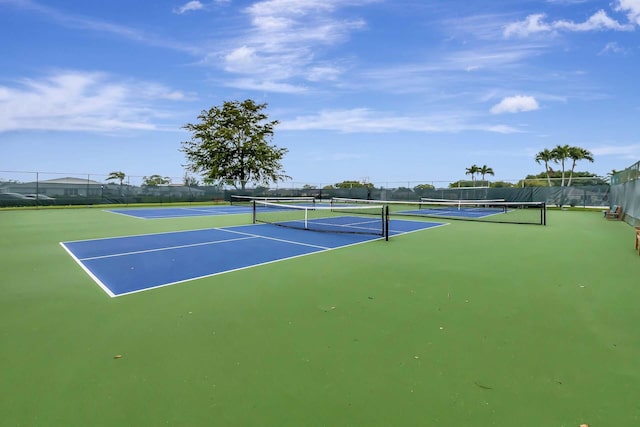 view of tennis court with fence