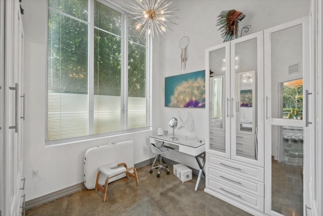 interior space featuring an inviting chandelier, visible vents, and baseboards