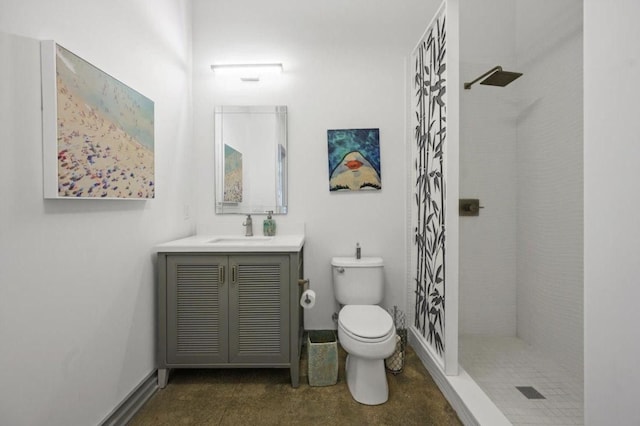 full bath featuring baseboards, a shower stall, toilet, and vanity